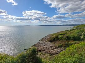 A coastal view with water and rocks at 28 Rock Villas in Silverdale