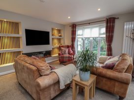 A living room with a sofa and armchair at Little Willesleigh Goodleigh near Barnstaple
