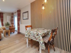 A dining room with a table and chairs at Little Willesleigh Goodleigh near Barnstaple