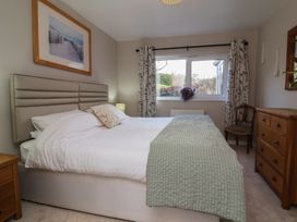 A bedroom with a bed and window at Little Willesleigh Goodleigh near Barnstaple