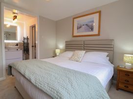 A bedroom with a bed and nightstand at Little Willesleigh in Goodleigh near Barnstaple
