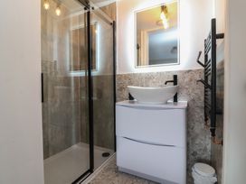 A bathroom with a shower and sink at Little Willesleigh Goodleigh near Barnstaple