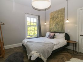 A bedroom with a bed and a window at Gweryl Lodge in Conwy
