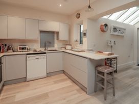 A kitchen with modern appliances and countertop at Full Deck in Dartmouth