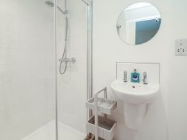 A bathroom with a shower and a sink at Full Deck in Dartmouth