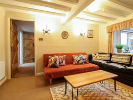 A living room with a sofa and coffee table at Bryn Y Garreg - The Wireless Free Farm (No Tech!) Y Trallwng