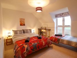 A bedroom with a bed and a desk at Bryn Y Garreg - The Wireless Free Farm (No Tech!) in Y Trallwng