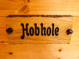 A wooden nameplate with the word Hobhole mounted on a wooden wall at Hobhole in Keal Cotes near East Kirkby
