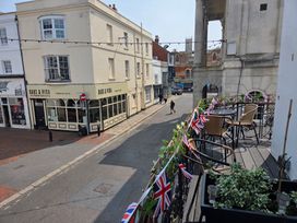An outdoor view of a restaurant and street at Harbour Retreat in Weymouth