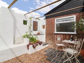 An outdoor area with a table and chairs at The Corner House Ufford near Woodbridge