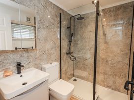 A bathroom with a shower, toilet and sink at Lakeside Lodge Bowland Lakes Leisure Village near Garstang