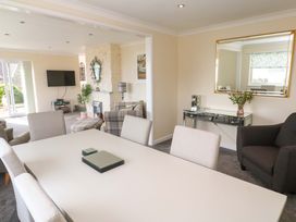 A dining room with a table and chairs at Karenza in Penzance