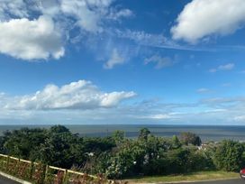 A view of the sea and wind turbines at Golygfa Gele in Llanddulas