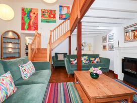 A living room with a sofa and coffee table at Rosemaddon in Crantock