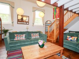 A living room with sofas and a coffee table at Rosemaddon in Crantock