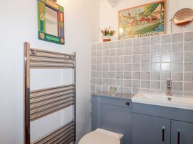 A bathroom with a sink and toilet at Rosemaddon in Crantock
