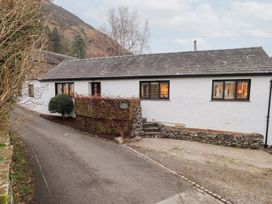 A house with windows and a driveway at Jasmine Cottage Thornthwaite
