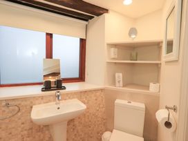 A bathroom with a sink and toilet at Jasmine Cottage in Thornthwaite