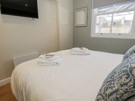 A bedroom with a bed and towels at Vista Mare 1 Weymouth