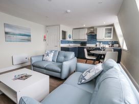 A living room with a sofa and a coffee table at Vista Mare 3 in Weymouth