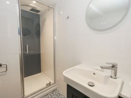 A bathroom with a shower and sink at Vista Mare 3 Weymouth