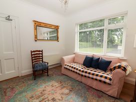 A living room with a sofa and a chair at Rosemont in Adare