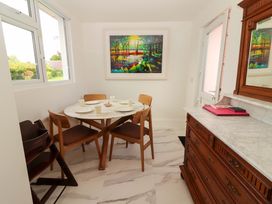 A dining room with a table and chairs at Rosemont in Adare