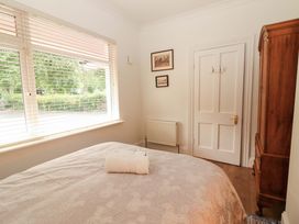 A bedroom with a bed and window at Rosemont in Adare
