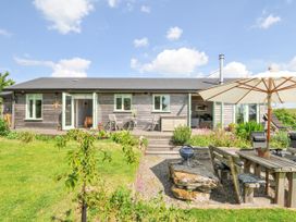 A house with outdoor seating and a garden at Smugglers Bodmin Moor, St Breward near St Tudy