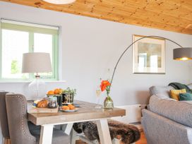 A dining room with a table and chairs at Smugglers Bodmin Moor, St Breward near St Tudy
