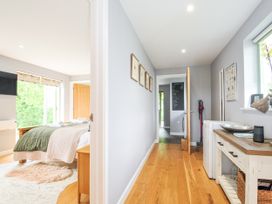 A hallway with wooden flooring and access to rooms at Smugglers, Bodmin Moor, St Breward near St Tudy