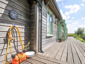 A deck area with plumbing for rinsing pets at Smugglers Bodmin Moor, St Breward near St Tudy