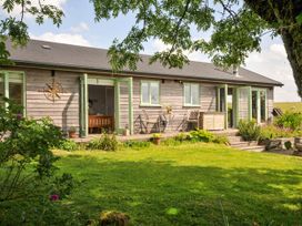 An exterior view of a house with garden features at Smugglers, Bodmin Moor, St Breward near St Tudy