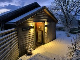 An entrance to Smugglers with a path covered in snow at Smugglers, Bodmin Moor, St Breward near St Tudy