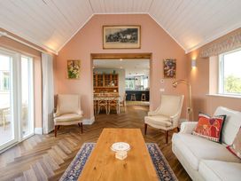 A living room with a coffee table and armchairs at Hoddell Pitch Cottage Kinnerton near New Radnor