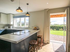 A kitchen with a window and counter at Hoddell Pitch Cottage Kinnerton near New Radnor
