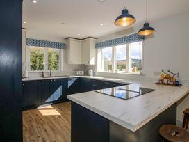 A kitchen with cabinets and a countertop at Hoddell Pitch Cottage in Kinnerton near New Radnor