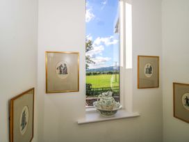 An interior view with framed art and a window at Hoddell Pitch Cottage Kinnerton near New Radnor
