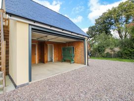 A garage with a green storage box in Kinnerton near New Radnor Hoddell Pitch Cottage