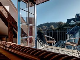 A balcony with chairs and a view at Bayview Tower in Lynton