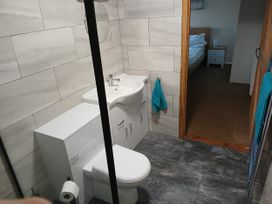 A bathroom with a toilet and sink at The Dairy Barn in Camelford