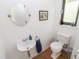 A bathroom with a sink and toilet at Green Shutters Freshwater East near Lamphey