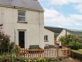 An outdoor area with a house and garden at Aunty Junes Cottage Okehampton