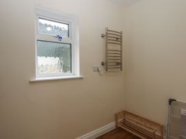 A utility room with a window and towel rail at Aunty Junes Cottage in Okehampton