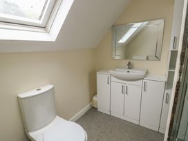 A bathroom with a sink and toilet at 9 Beckett Close in Colwyn Bay