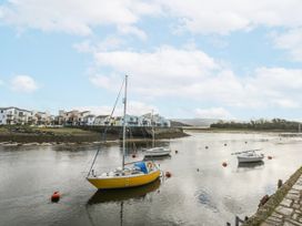A view of boats in water with houses in the background at Oakley View Apartment Porthmadog