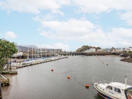 A marina with boats and a bridge at Oakley View Apartment Porthmadog