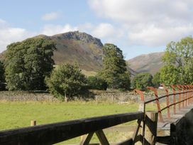 A view of a mountain and trees in a field at 2 Bakers Yard
