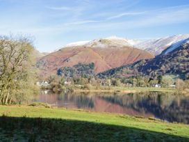 A scenic view of mountains and a lake with trees at 2 Bakers Yard