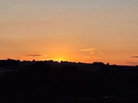 A sunset over the hills at The Halt in Maiden Newton
